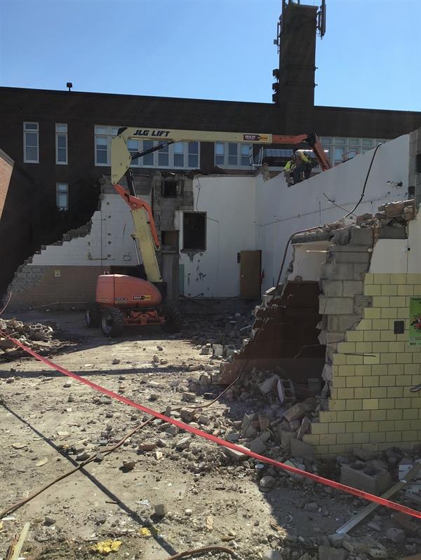 Former cafeteria being demolished to clear space for new construction